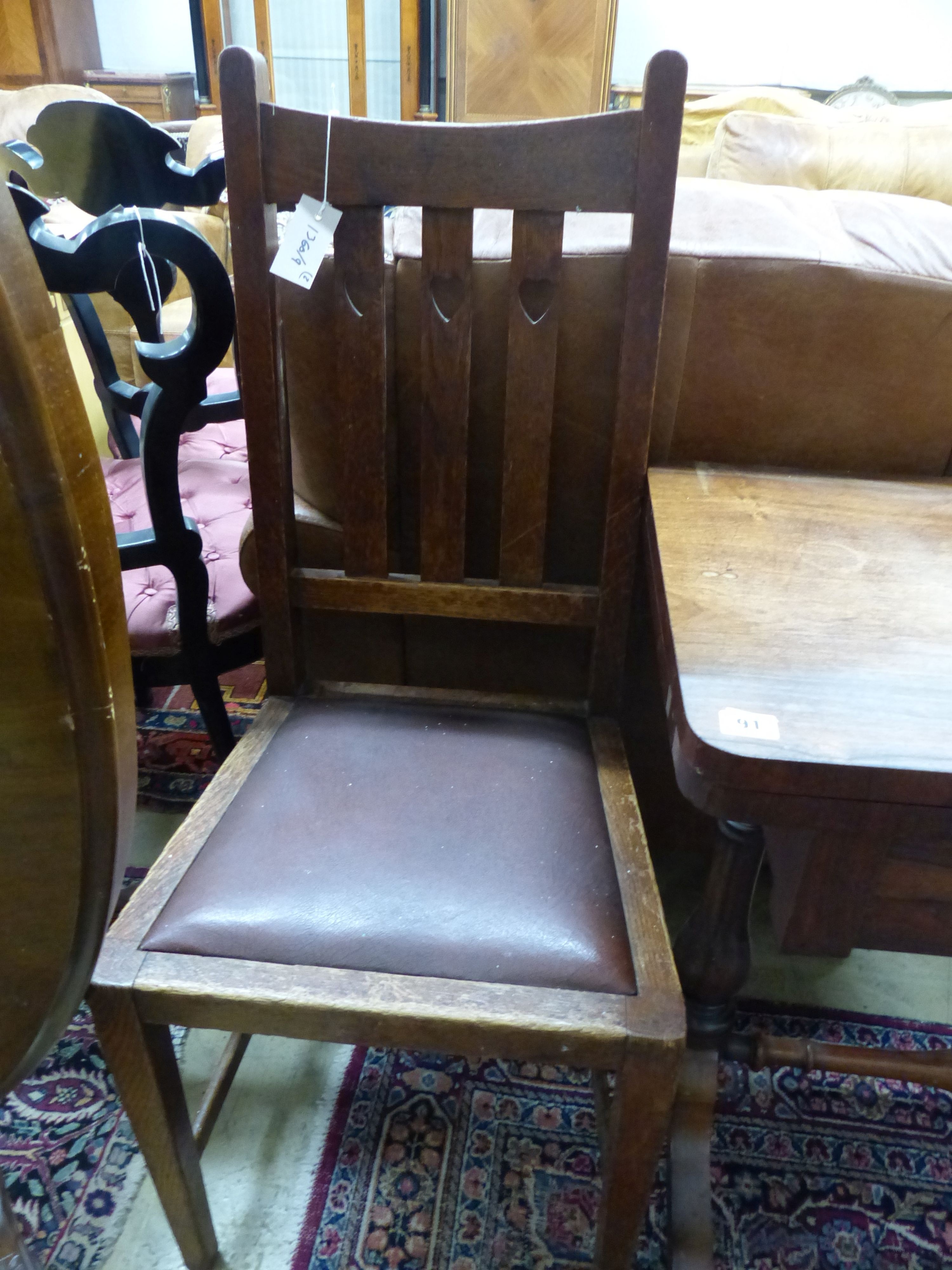 A Victorian rosewood rectangular folding card table, W.91cm D.45cm H.73cm, and an Arts and Crafts oak dining chair